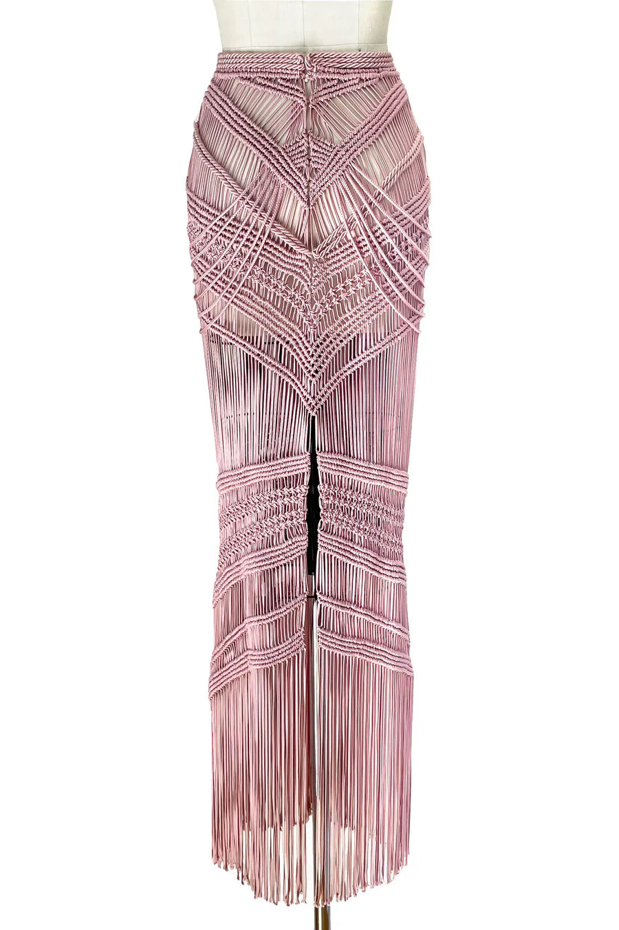 Pink beaded skirt on a mannequin against a white background