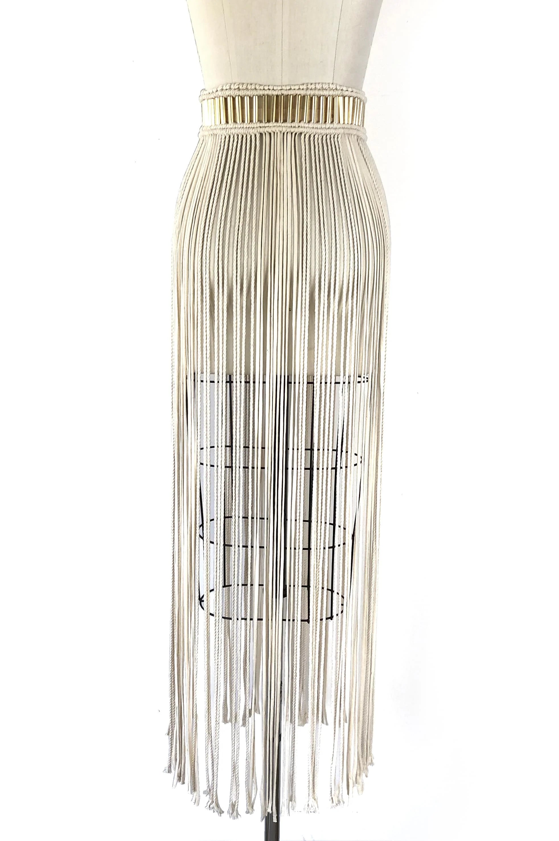 Mannequin wearing a dress with a long fringe skirt on a white background